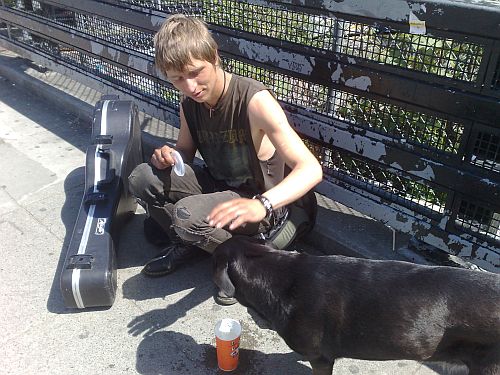 1 Blond Musician on Commercial Dr petting dog