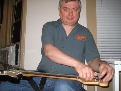 Al Restringing a guitar 1 500 Al Restringing a guitar 1 500