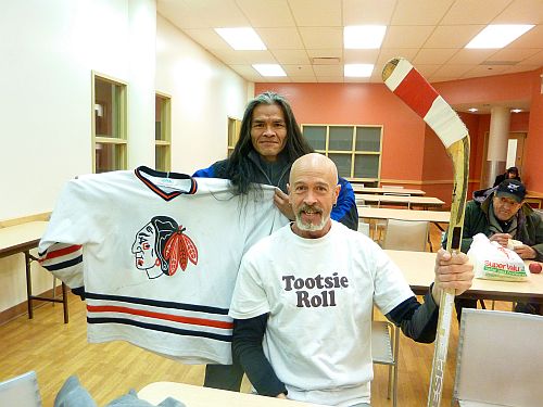 Clyde Wright and Van Jensen hold up donations