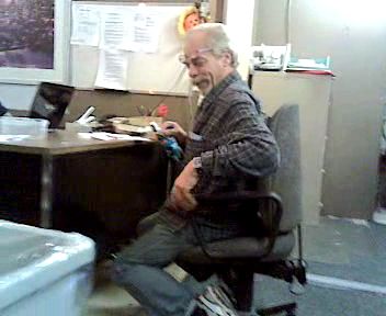 Henrik Beune chair that makes employees close to the ground and almost on their knees