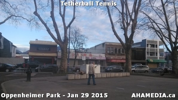 1 AHA MEDIA sees man playing tetherball tennis in Oppenheimer Park in Vancouver DTES