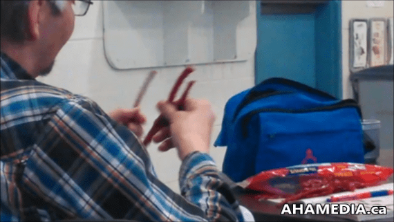 Man separates Twizzlers sticks 1