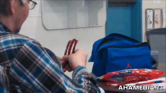 Man separates Twizzlers sticks 2